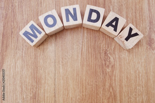 monday wooden letter alphabet on wooden background