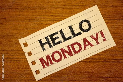 Writing note showing Hello Monday Motivational Call. Business photo showcasing Positive Message for a new day Week Start Text two word white paper note wood desk quick sketch school work pen.