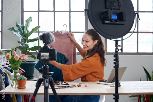 Fashion influencer vlogger creating videos for her channel