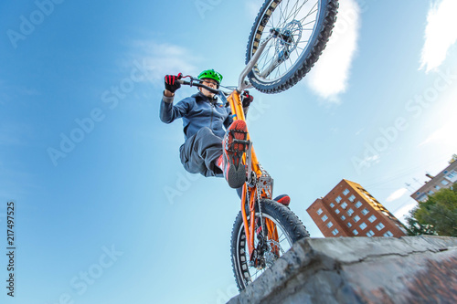 professional BMX rider made tricks on bicycle © Sergey