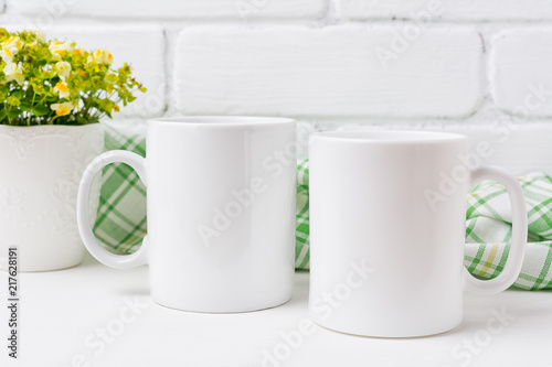 Two coffee mug mockup with yellow and green flowers