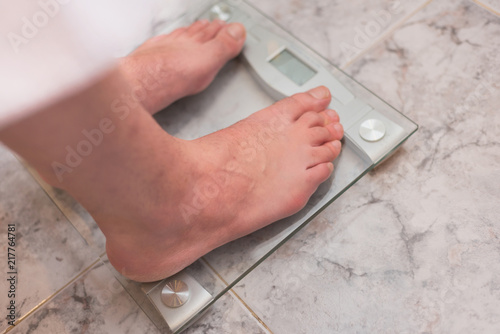Man Feet Standing On Weight Scale Man Feet Standing On Weight Scale