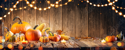 Thanksgiving With Pumpkins And Corncob On Wooden Table © Romolo Tavani