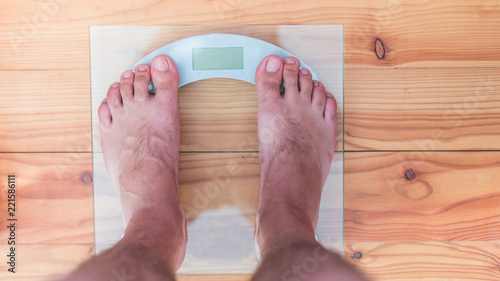 Male Bare Feet On Weight Scale Male Bare Feet On Weight Scale