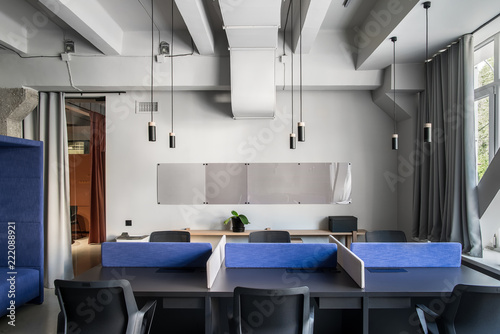Stylish office in loft style with gray walls © Andriy Bezuglov