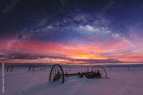 Panoramic winter landscape in sunrise with double exposure night sky landscape