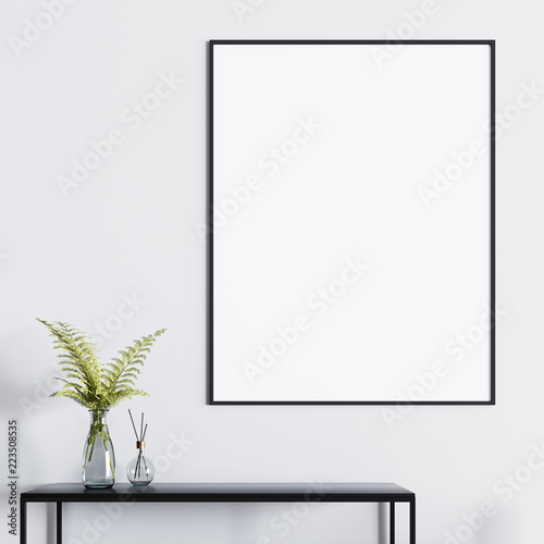 Mockup poster above the table with a plant in a glass vase. © ostap25
