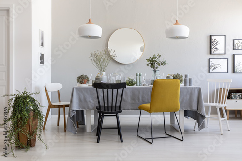 Black And Yellow Chair At Table In White Dining Room Interior With Black And Yellow Chair At Table In White Dining Room Interior With Plants Lamps