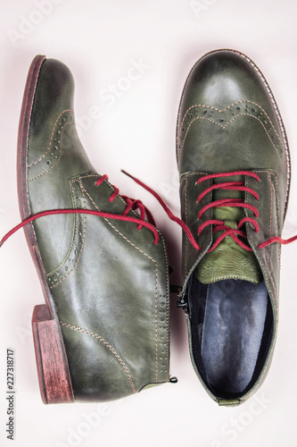 A Pair Of Khaki Color Oxford Man Shoes With Red Shoelaced On White A Pair Of Khaki Color Oxford Man Shoes With Red Shoelaced On White Background Fashion