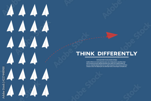 Think different. Think differently concept. Red airplane changing direction. New idea, change, trend, courage, creative solution, innovation and unique way concept.