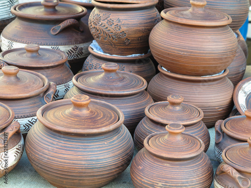 Handmade ceramic clay brown pottery, souvenirs at handicraft market © alexrow