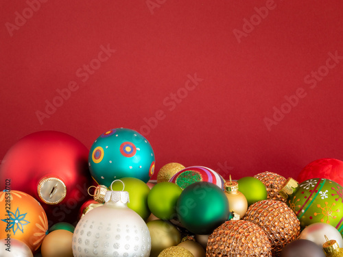 Christmas decoration glass balls on red background © magann