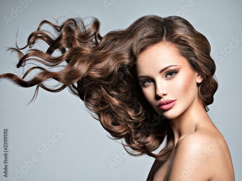 Face of a beautiful woman with long flying hair © Valua Vitaly