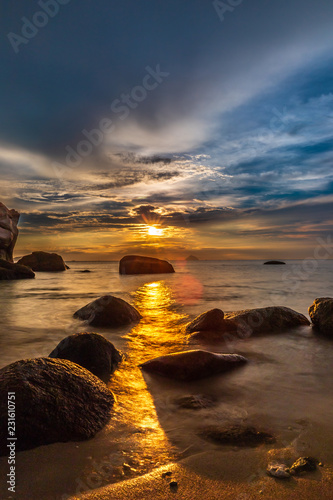 sunset on rocky beach © BenKhang