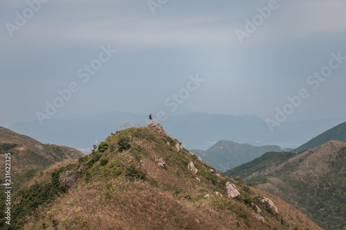 Man On Mountain Peak