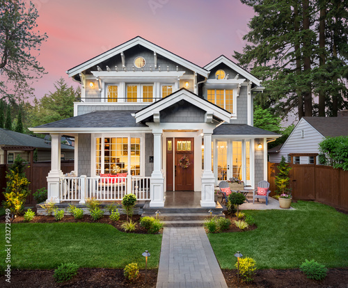 Beautiful Home Exterior at Sunset with Colorful Sky