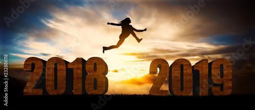 woman jump over silhouette Happy New Year 2019