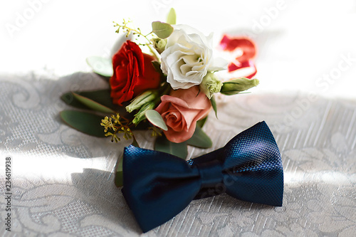 Wedding accessories of the groom, dark blue butterfly with a flower bouquet © Надія Коваль