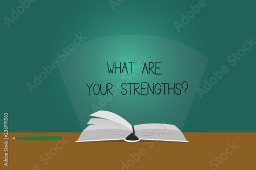 Writing note showing What Are Your Strengthsquestion. Business photo showcasing Tell us your best qualities skills Color Pages of Book on Table with Pen and Light Beam Glaring © Artur
