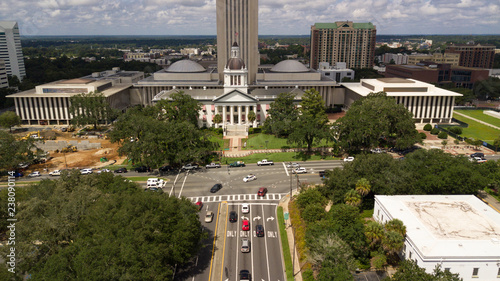 Flags Blow Atop Traffic Below The Capital Dome In Tallah Ee Florida Flags Blow Atop Traffic Below The Capital Dome In Tallah Ee Florida