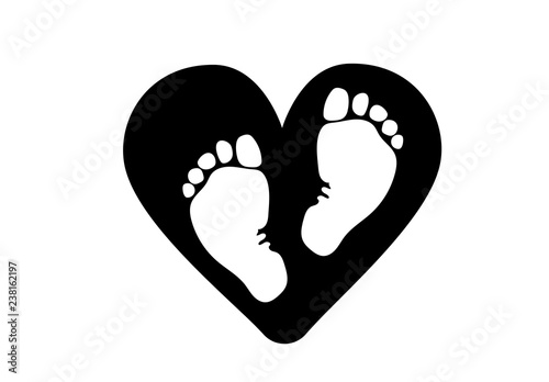 Favorite baby legs on the background of the heart. The concept of love, protection and motherhood. Children Protection Day.