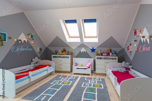 Modern bedroom for boy and girl with furnitures and toys © Patryk Kosmider