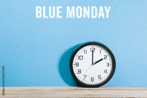 Blue Monday words on blue colored background with clock © MichaelJBerlin
