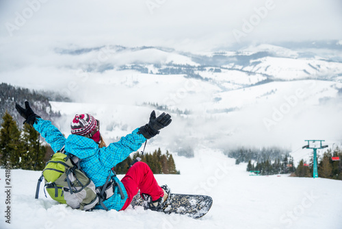 Young woman on the snowboard © nickolya