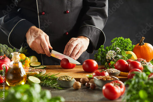 Chef slicing salad ingredients in a restaurant © exclusive-design