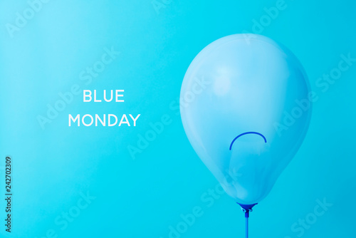 blue balloon with a sad face and text blue monday © nito
