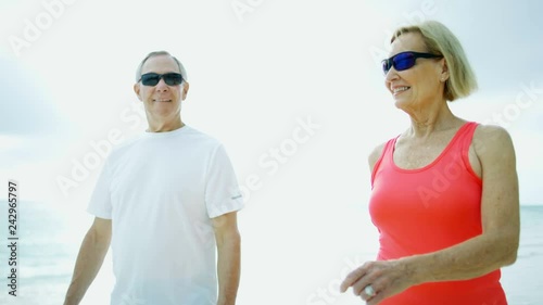 Male and female seniors training on beach Bahamas © Spotmatik