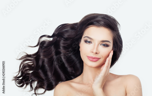 Beautiful female face on white background. Young woman with curly hair © millaf