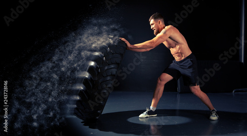 Crossfit training - man flipping tire © Andrey Burmakin