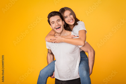 Lovely couple having fun, man piggybacking his girlfriend © Prostock-studio
