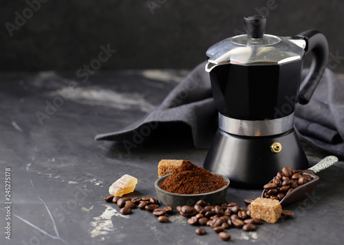 still life of coffee, grains and ground on a black background