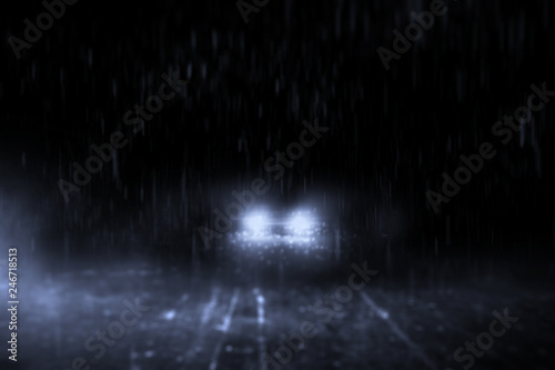 Abstract lonely streets at night, with cars running in the rain