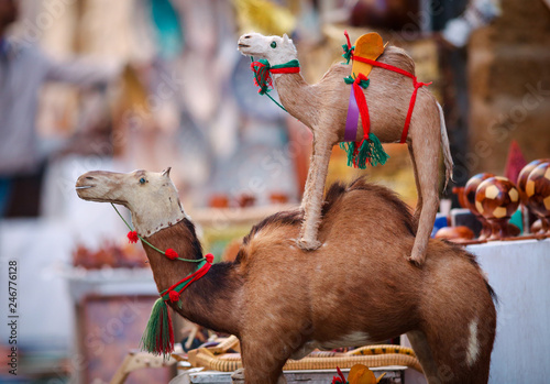 Two toy camels in a street shop in Essaouira medina oldtown, Morocco © Skaniai