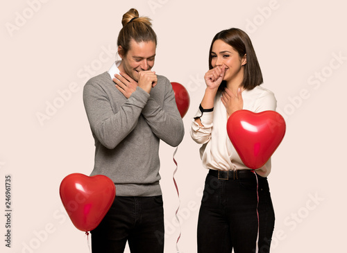 Couple in valentine day is suffering with cough and feeling bad over isolated background © luismolinero