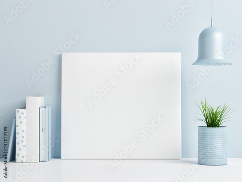 Mock up poster on blue background wall, minimalism composition, 3d render, 3d illustration © nikolarakic