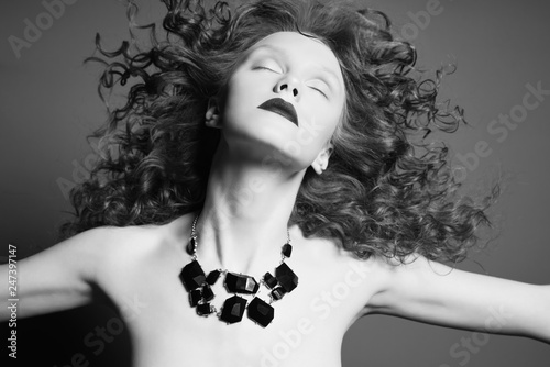 Beautiful nude woman with black jewelry. Fashion portrait © George Mayer