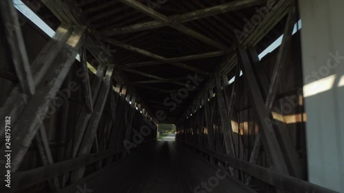 Smooth drive through footage of an old covered bridge in the midwest country © blackboxguild