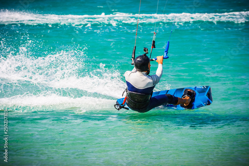 Kite surfer performing difficult tricks in high winds. Extrme sports shot in Tarifa, Andalusia, Spain © Giulio