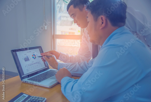 Business team working on a new business plan with modern digital computer