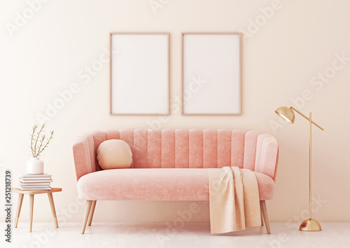 Poster mock up with two vertical frames on beige wall in living room interior with pastel coral pink sofa, lamp and plant in vase. 3D rendering. © marina_dikh