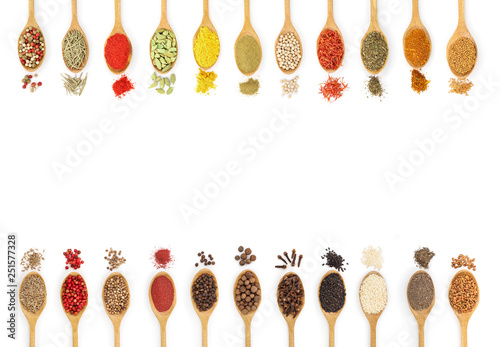 mix of spices in wooden spoon isolated on a white background with copy space for your text. Top view. Flat lay. Set or collection © kolesnikovserg