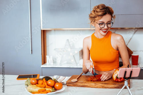 Joyful happy woman having online video stream