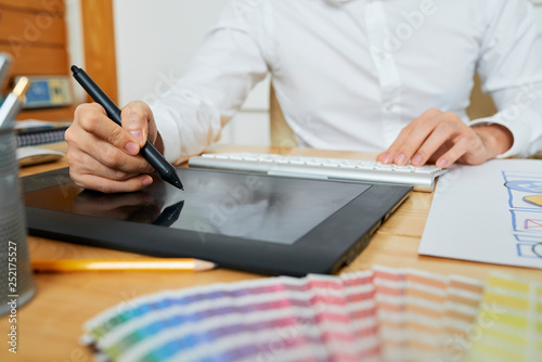 Designer working on graphic tablet © DragonImages