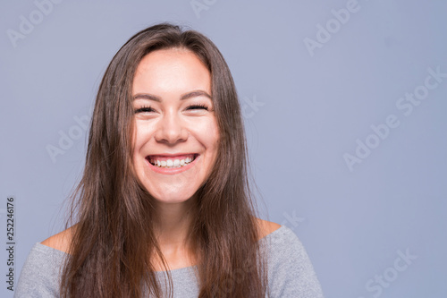 Young positive girl with dark long hair © stockaboo
