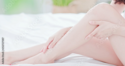 asian woman touch her leg © ryanking999