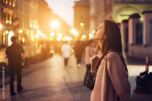 Beautiful girl in the evening on the street